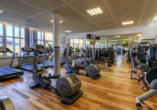 Halten Sie sich im Fitnessraum des Sport- & Vital-Resorts Neuer Hennings Hof fit.