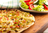 Leckere Speisen wie Flammkuchen lassen das Genießerherz höherschlagen.